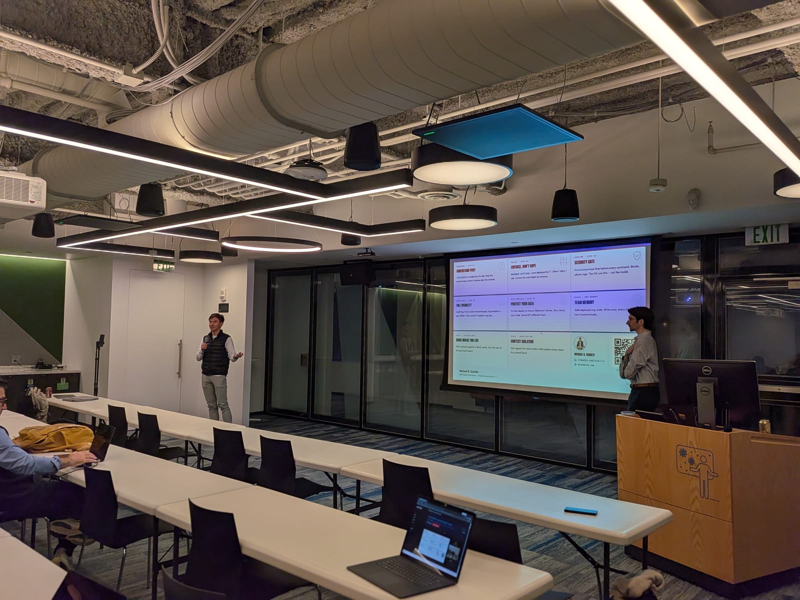 A speaker walking through a takeaways slide for the room