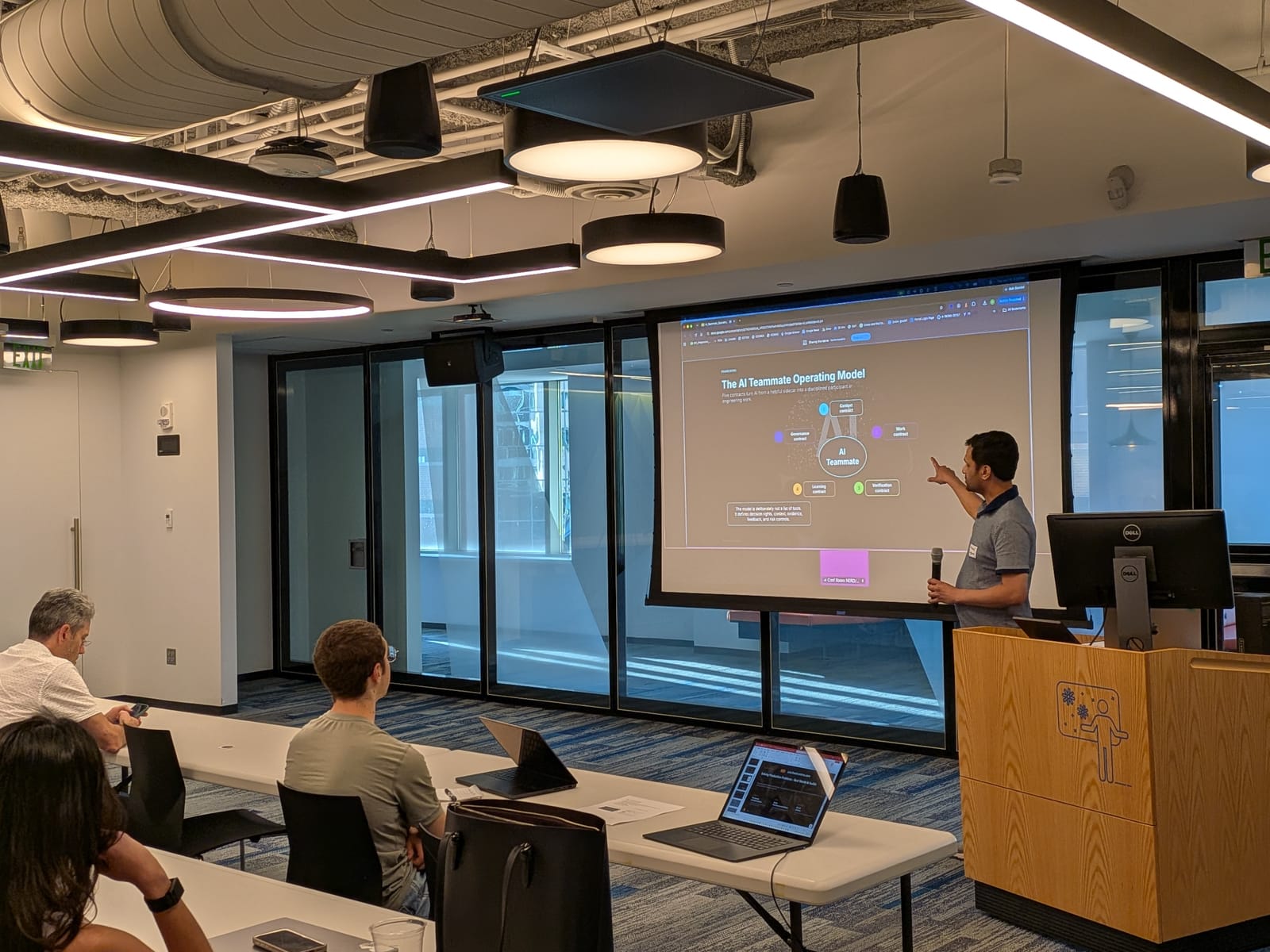 Nirmal Jingar presenting the AI Teammate Operating Model at the podium