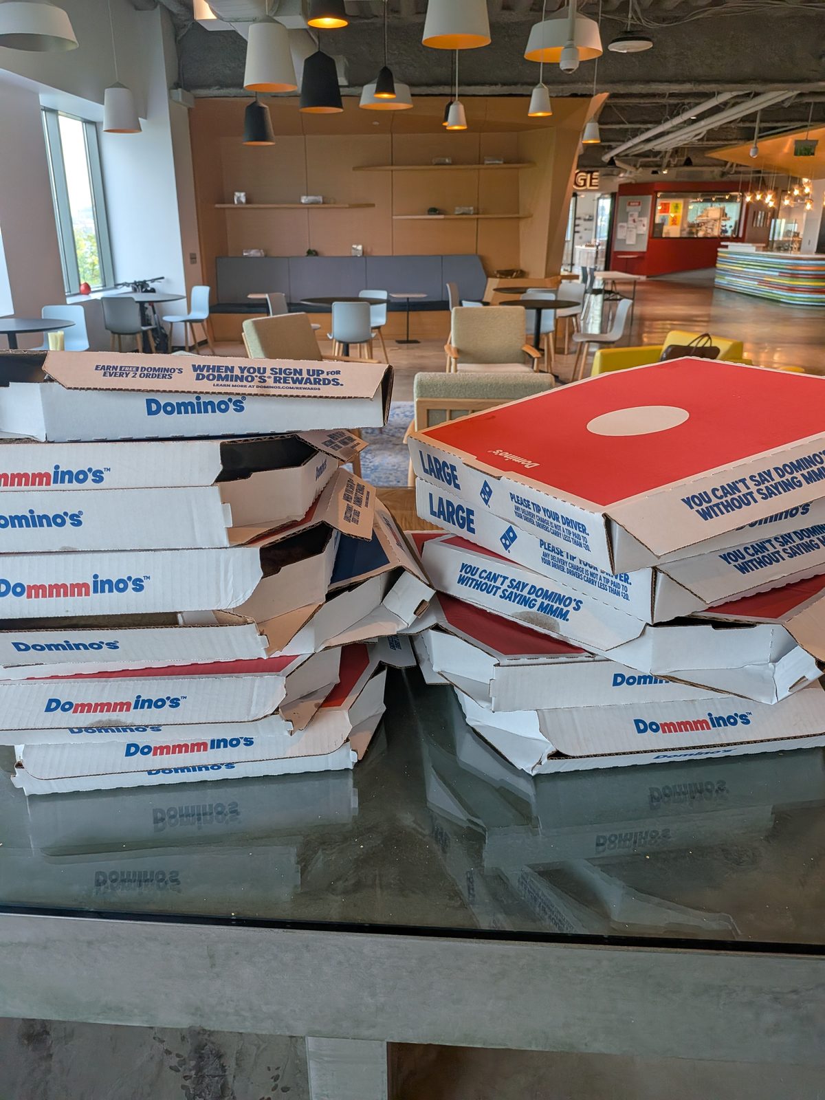 Pizza boxes stacked in the lounge at Microsoft NERD before doors